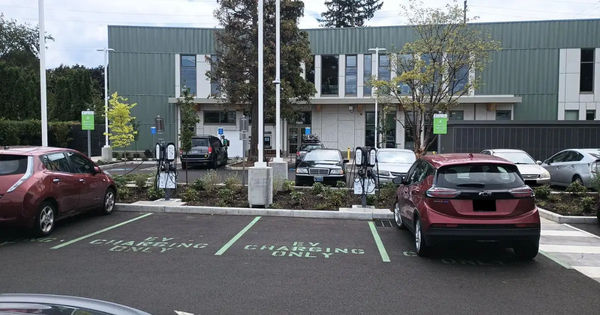 Commercial EV charging stations in a retail center parking lot